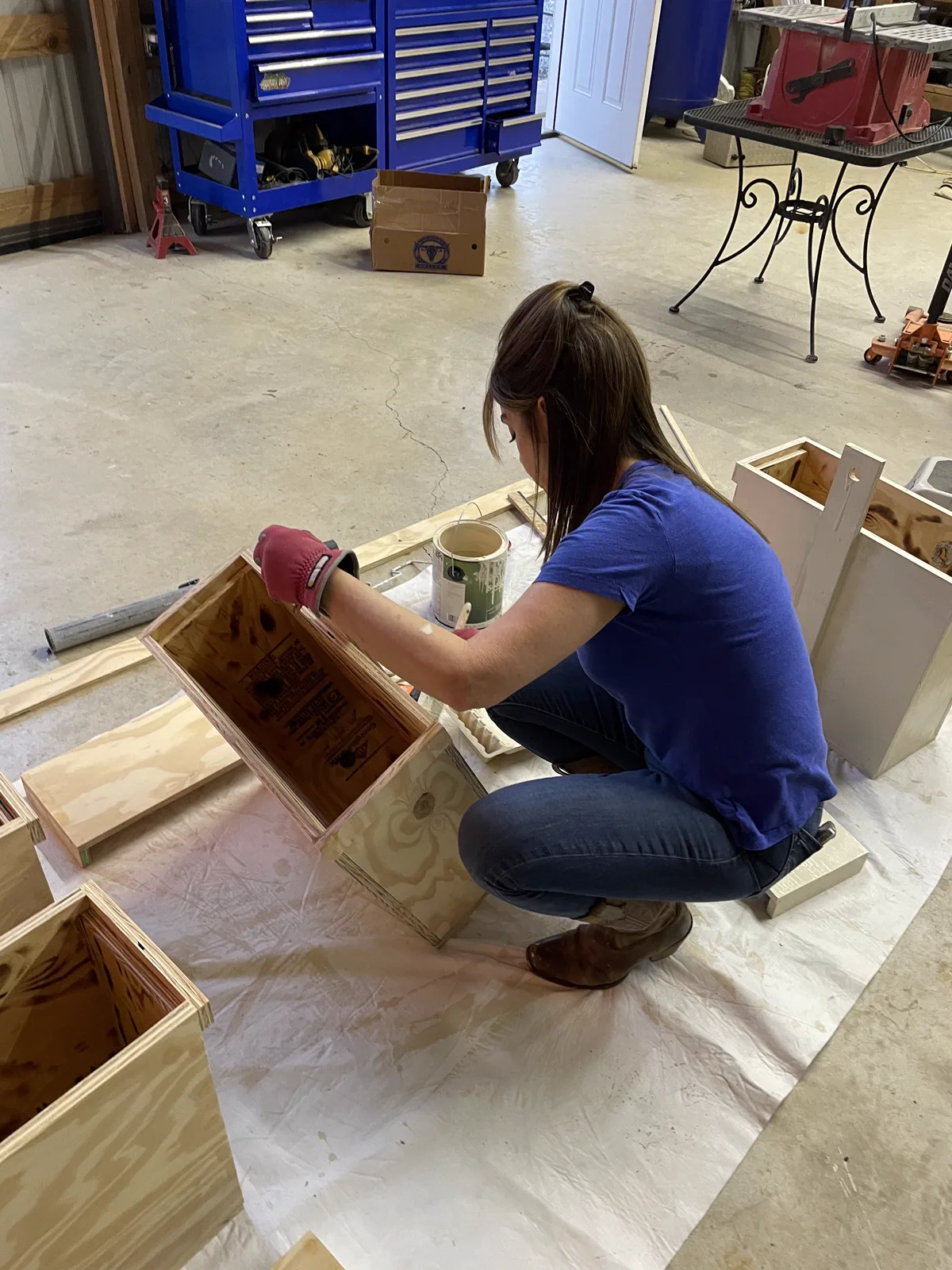 Shanon painting a swarm box
